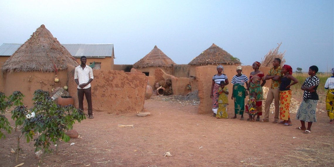 NAKOM still - family at burial.jpg